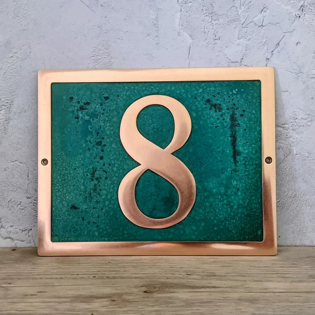 recent-work-solid-bronze-house-number-plaque-with-patina-background